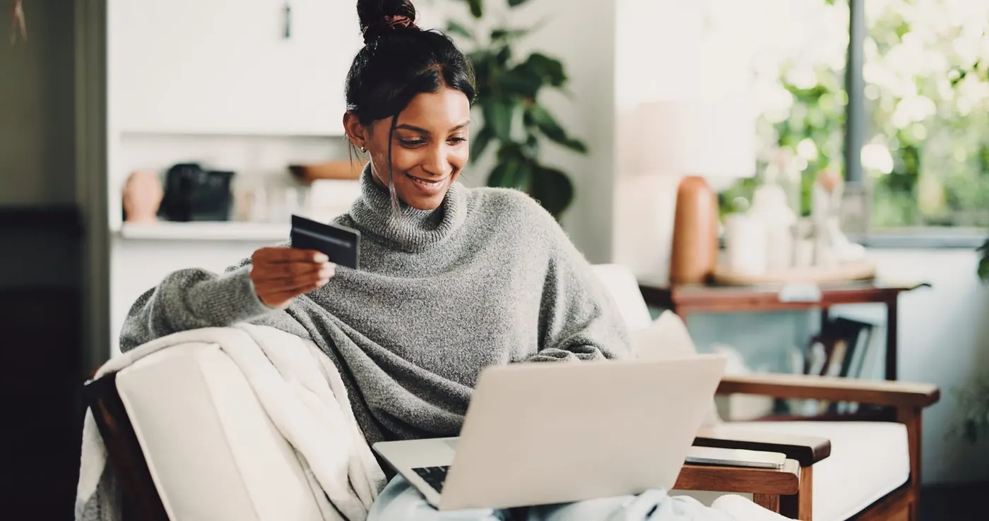 Shopper buying on a laptop with her card