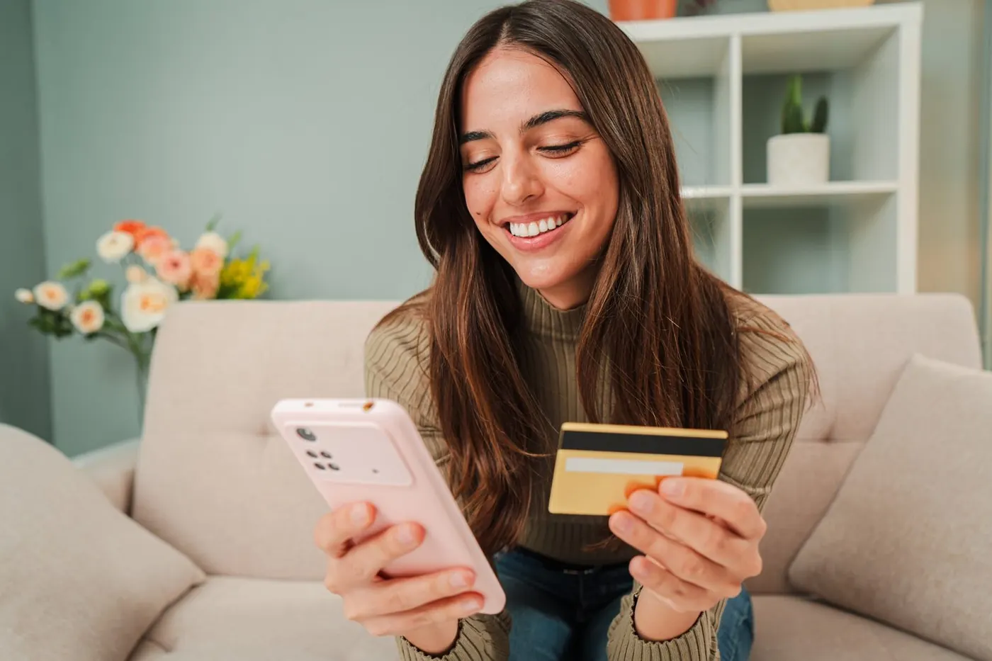 Customer paying on her phone with a card